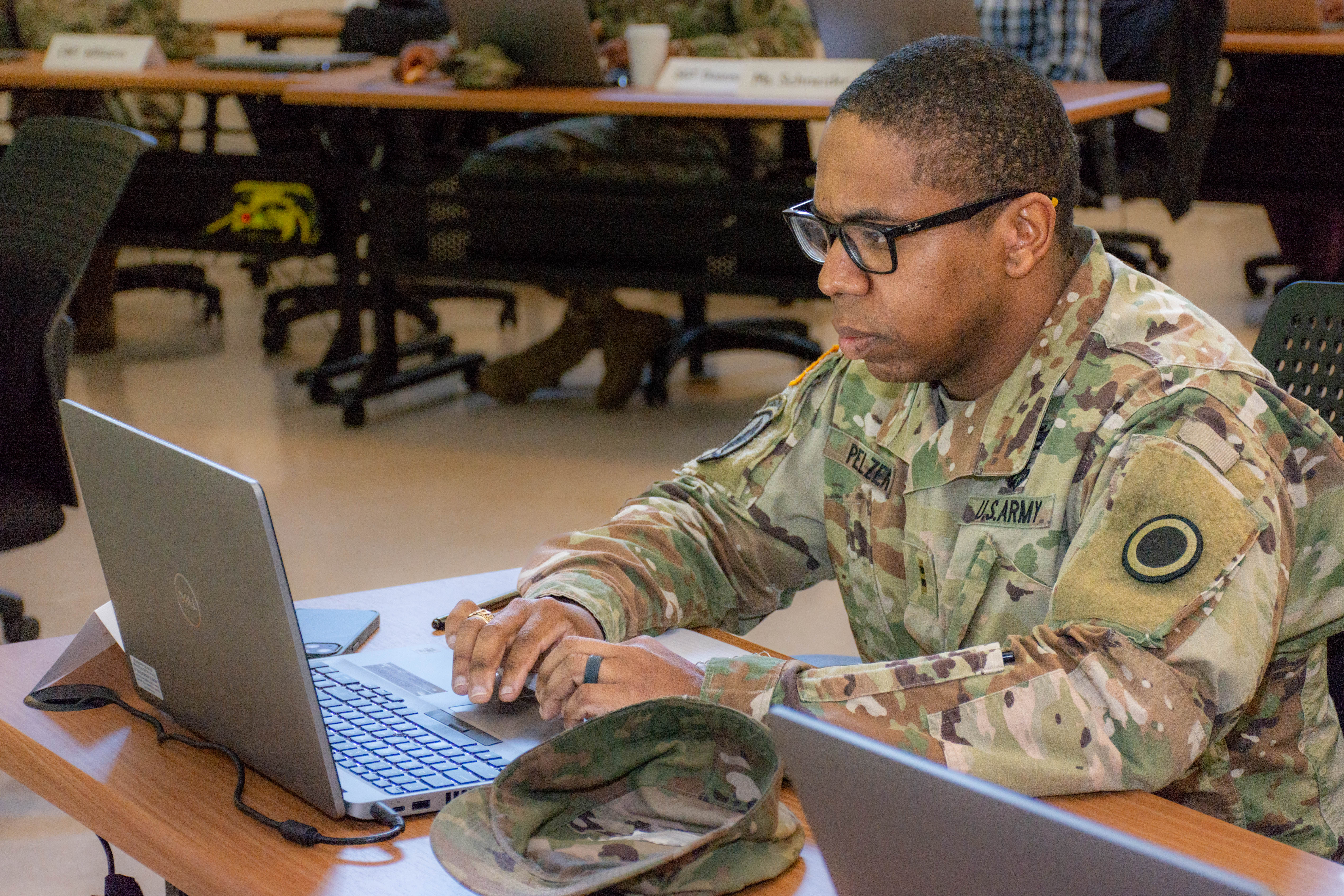 Soldier completing training on laptop